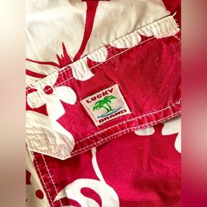 Red Pareau Hibiscus Hawaiian print Lucky Brand Dungarees by Gene Montesano.